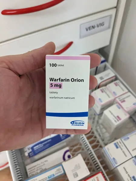 stock image Prague,Czech republic-January 8 2024: box of  WARFARIN PMCS Package of Warfarin Tablets, used to thin blood in patients who are at risk of blood clots which can cause strokes and heart diseases.