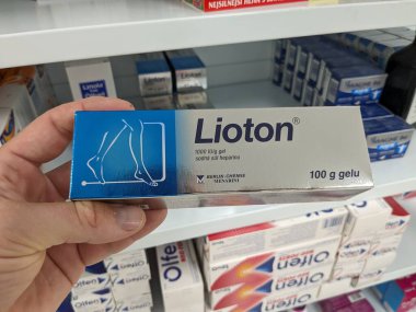 Prague, Czech Republic - July 10 2024: LIOTON box of topical treatment with HEPARIN active substance by MENARINI, used for treatment of bruises, sprains, and varicose veins. clipart