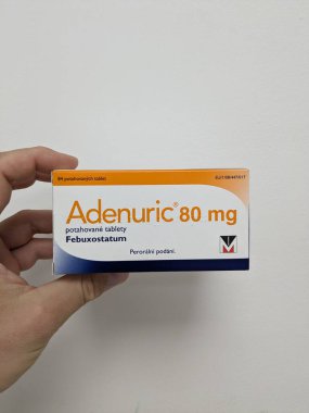 Prague,Czech Republic-October 9 2024: Adenuric by MENARINI contains FEBUXOSTAT, a medication used for managing chronic hyperuricemia and gout, helping reduce uric acid levels effectively. clipart