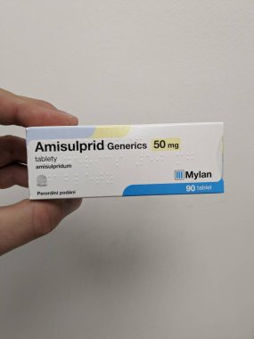 Prague, Czech Republic - SEPTEMBER 13 2024: AMISULPRID GENERICS box of medication with AMISULPRIDE active substance by GENERICS, used for treatment of schizophrenia. clipart