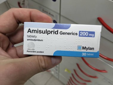 Prague, Czech Republic - SEPTEMBER 13 2024: AMISULPRID GENERICS box of medication with AMISULPRIDE active substance by GENERICS, used for treatment of schizophrenia. clipart