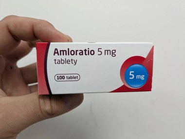 Prague, Czech Republic - July 9 2024: AMLORATIO box of tablets with AMLODIPINE active substance by SANDOZ, used for treatment of hypertension and angina. clipart