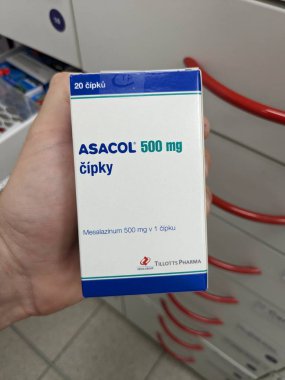 Prague, Czech Republic -December 10 2024: ASACOL box of medication with MESALAZINE active substance by TILLOTTS PHARMA, used for treatment of ulcerative colitis and Crohn's disease. clipart