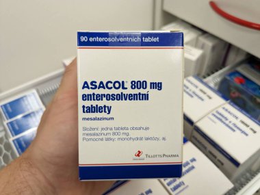 Prague, Czech Republic -December 10 2024: ASACOL box of medication with MESALAZINE active substance by TILLOTTS PHARMA, used for treatment of ulcerative colitis and Crohn's disease. clipart