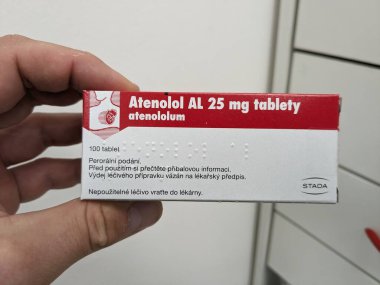 Prague, Czech Republic - July 10 2024: ATENLOL AL box of medication with ATENOLOL active substance by ALIUD PHARMA, used for treatment of hypertension and cardiovascular health. clipart