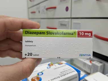 Prague, Czech Republic - July 10 2024: DIAZEPAM SLOVAKOFARMA box of medication with DIAZEPAM active substance by SLOVAKOFARMA, used for treatment of anxiety, muscle spasms, and seizures. clipart