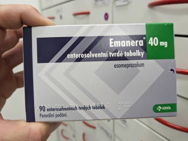 Prague, Czech Republic - July 10 2024: EMANERA box of medication with ESOMEPRAZOLE active substance by KRKA, used for treatment of acid reflux and stomach ulcers. clipart