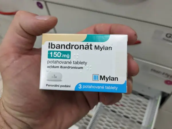 stock image Prague,Czech Republic-August 10 2024: IBANDRONAT MYLAN box of tablets with IBANDRONIC ACID active substance, used for treatment of osteoporosis, bone health.