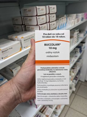 Prague, Czech Republic - JULY 10 2024: Buccolam box of medication with midazolam active substance by Neuraxpharm, used for treatment of prolonged acute convulsive seizures in children and adolescents. clipart