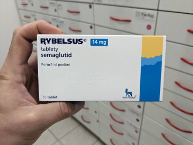 Prague, Czech Republic - July 10 2024: RYBELSUS box of medication with SEMAGLUTIDE active substance by NOVO NORDISK, used for treatment of type 2 diabetes and blood sugar control. clipart