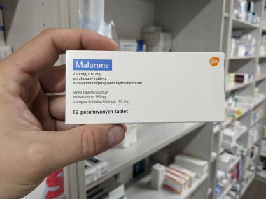 Prague, Czech Republic - July 10 2024: MALARONE box of medication with ATOVAQUONE and PROGUANIL active substances by GLAXOSMITHKLINE, used for prevention and treatment of malaria. clipart