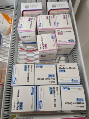 Prague, Czech Republic - July 10 2024: WARFARIN ORION box of medication with WARFARIN active substance by ORION, used for prevention and treatment of blood clots. clipart