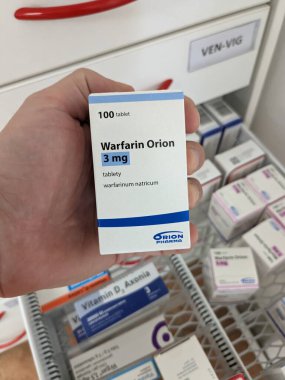 Prague, Czech Republic - July 10 2024: WARFARIN ORION box of medication with WARFARIN active substance by ORION, used for prevention and treatment of blood clots. clipart