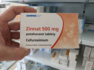 Prague, Czech Republic - July 10 2024: ZINNAT box of medication with CEFUROXIME AXETIL active substance by GLAXOSMITHKLINE, used for treatment of bacterial infections in children. clipart