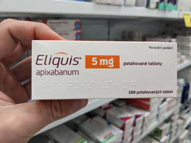 Prague, Czech Republic - July 10 2024: ELIQUIS box of medication with APIXABAN active substance by BRISTOL-MYERS SQUIBB, used for treatment of blood clot prevention and stroke prevention. clipart