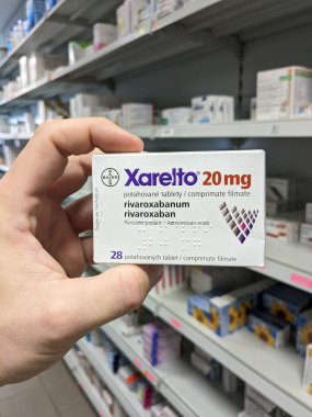 Prague, Czech Republic - July 10 2024: XARELTO box of medication with RIVAROXABAN active substance by BAYER, used for prevention and treatment of blood clots. clipart