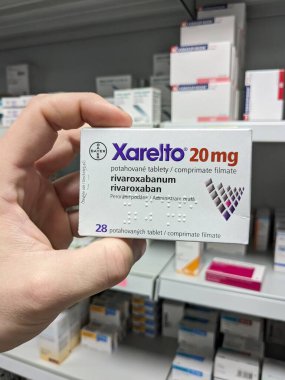 Prague, Czech Republic - July 10 2024: XARELTO box of medication with RIVAROXABAN active substance by BAYER, used for prevention and treatment of blood clots. clipart