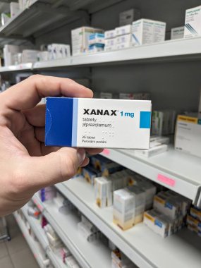 Prague, Czech Republic - July 10 2024: XANAX box of medication with ALPRAZOLAM active substance by PFIZER, used for treatment of anxiety and panic disorder. clipart