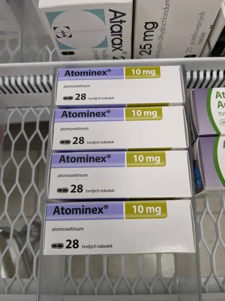 stock image Prague, Czech Republic - July 10 2024: ATOMINEX box of medication with ATOMOXETINE active substance by INTAS, used for treatment of ADHD.