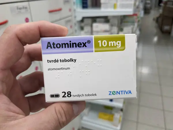 stock image Prague, Czech Republic - July 10 2024: ATOMINEX box of medication with ATOMOXETINE active substance by INTAS, used for treatment of ADHD.