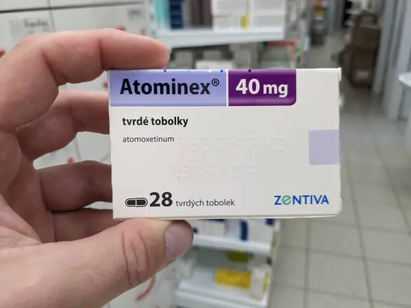 stock image Prague, Czech Republic - July 10 2024: ATOMINEX box of medication with ATOMOXETINE active substance by INTAS, used for treatment of ADHD.