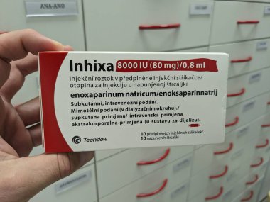 Prague, Czech Republic - July 10 2024: INHIXA box of medication with ENOXAPARIN SODIUM active substance by TECHDOW, used for prevention and treatment of blood clots. clipart