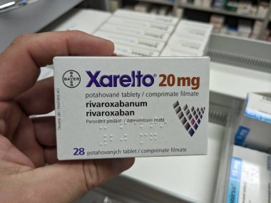 Prague,Czech Republic-August 7 2024: XARELTO box of medication with RIVAROXABAN active substance by BAYER,used for prevention of stroke,deep vein thrombosis,pulmonary embolism clipart