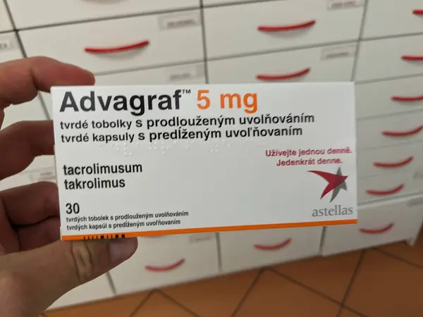 stock image Prague, Czech Republic-August 10 2024: ADVAGRAF box of capsules with TACROLIMUS active substance, used for prevention of organ rejection in kidney and liver transplants, immunosuppressant therapy.