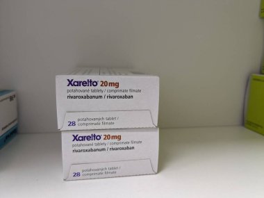 Prague, Czech Republic - July 9 2024: XARELTO tablets with RIVAROXABAN active substance by BAYER, used as an anticoagulant for blood thinning and prevention of deep vein thrombosis, pulmonary embolism, atrial fibrillation, and stroke. clipart