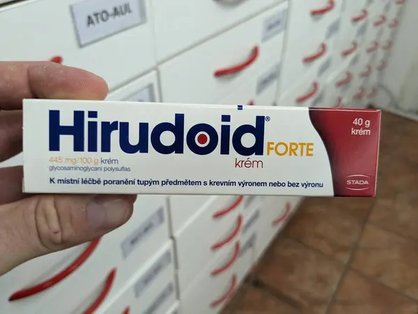 stock image Prague, Czech Republic - July 9 2024: HIRUDOID box of cream with HEPARINOID active substance by STADA, used for treatment of bruises and anti-inflammatory care.