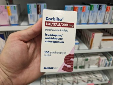 Prague,Czech Republic-October 9 2024: CORBILTA by SANDOZ, containing LEVODOPA, CARBIDOPA, and ENTACAPONE, is used to treat Parkinsons disease by improving movement and reducing symptoms like stiffnes clipart