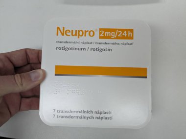 Prague,Czech republic-August 16 2023:Neupro 8mg 24h TTD drug system, Rotigotinum-rotigotin is a dopamine agonist of the non-ergoline class of medications indicated for the treatment of Parkinson dis. clipart