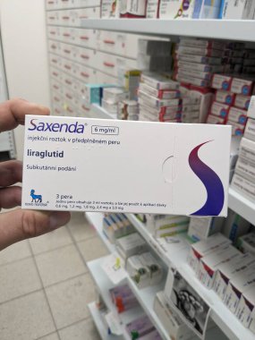 Prague, Czech Republic-NOvember 8 2024:SAXENDA box of medication with LIRAGLUTIDE active substance by NOVO NORDISK, used for weight loss and diabetes management. clipart