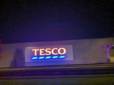 Kolin,Czech republic - August 26 2023: Tesco supermarket sign atop a store exterior.TESCO brand discount store hypermarket clipart