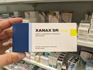 Prague, Czech Republic - SEPTEMBER 13 2024: XANAX box of medication with ALPRAZOLAM active substance by PFIZER, used for treatment of anxiety and panic disorders. clipart