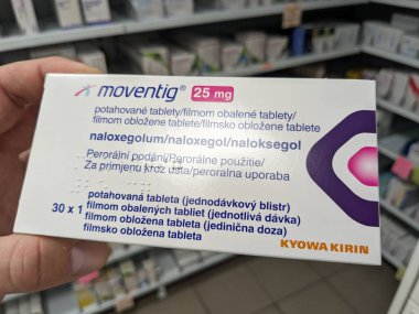 Prague,Czech Republic-August 10 2024: MOVENTIG box of tablets with NALOXEGOL active substance,used for treatment of opioid-induced constipation. clipart