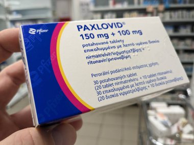 Prague,Czech republic-January 8 2024:Paxlovid box of medication with active substance Nirmatrelvir and ritonavir combination for COVID 19, cov19 treatment by Pfizer clipart