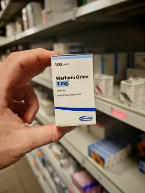 Prague, Czech Republic - SEPTEMBER 13 2024: WARFARIN ORION box of medication with WARFARIN active substance by ORION, used for treatment of blood clot prevention and stroke risk reduction. clipart