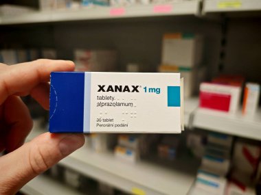 Prague, Czech Republic - SEPTEMBER 13 2024: XANAX box of medication with ALPRAZOLAM active substance by PFIZER, used for treatment of anxiety and panic disorders. clipart