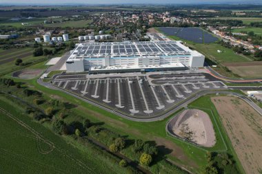 KOJETIN,Czech republic-September 24 2022:Brand new Amazon Warehouse distribution center. Aerial view of massive sort and distribute logistics center,Eur Amazon warehouse,Kojetin Czech solar powerplant clipart