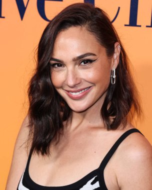 Israeli actress Gal Gadot (Gal Gadot-Varsano) wearing Michael Kors Collection with a Tyler Ellis bag arrives at the Veuve Clicquot 250th Anniversary Solaire Culture Exhibition Opening held at 468 North Rodeo Drive on October 25, 2022 in LA, USA. clipart