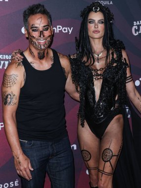 Richard Lee and girlfriend/Brazilian model Alessandra Ambrosio arrive at Darren Dzienciol's CARN*EVIL Halloween Party hosted by Alessandra Ambrosio held at a Private Residence on October 29, 2022 in Bel Air, Los Angeles, California, United States.  clipart