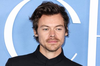 English singer, songwriter and actor Harry Styles wearing a Gucci suit arrives at the Los Angeles Premiere Of Amazon Prime Video's 'My Policeman' held at the Regency Bruin Theatre on November 1, 2022 in Westwood, Los Angeles, California, United State clipart