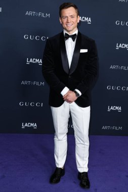 Taron Egerton, Gucci 'nin 5 Kasım 2022' de Los Angeles İlçe Sanat Müzesi 'nde sunduğu 11. LACMA Sanat + Film Galası 2022' ye geliyor..