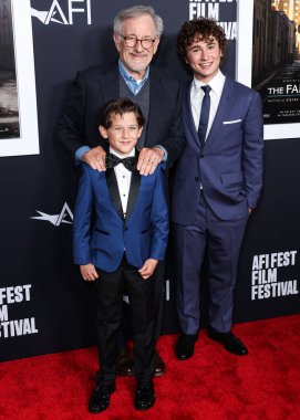 Mateo Zoryna Francis-DeFord, Steven Spielberg and Gabriel LaBelle arrive at the 2022 AFI Fest - Closing Night Special Screening Of Universal Pictures' 'The Fabelmans' held at the TCL Chinese Theatre IMAX on November 6, 2022 in Los Angeles, USA clipart
