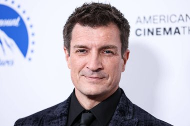 Canadian-American actor Nathan Fillion arrives at the 36th Annual American Cinematheque Awards Honoring Ryan Reynolds held at The Beverly Hilton Hotel on November 17, 2022 in Beverly Hills, Los Angeles, California, United States. clipart