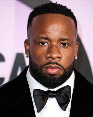 Yo Gotti (Mario Sentell Giden Mims) arrives at the 2022 American Music Awards (50th Annual American Music Awards) held at Microsoft Theater at L.A. Live on November 20, 2022 in Los Angeles, California, United States. clipart