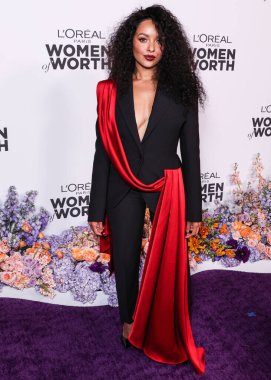American actress Kat Graham arrives at the L'Oreal Paris' Women Of Worth Celebration 2022 held at The Ebell of Los Angeles on December 1, 2022 in Los Angeles, California, United States. clipart