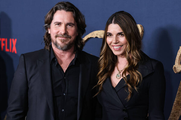 English actor Christian Bale and wife/American actress Sibi Blazic (Sibi Blai) arrive at the Los Angeles Premiere Of Netflix's 'The Pale Blue Eye' held at the Directors Guild of America Theater Complex on December 14, 2022 in Los Angeles