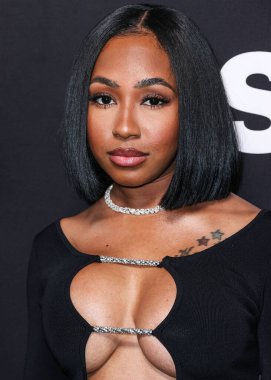 Amerikalı rapçi Yung Miami (Caresha Romeka Brownlee), STARZ 'ın' BMF '(Siyah Mafya Ailesi) 2. sezonunun Los Angeles Premiere' ine 5 Ocak 2023 'te Hollywood, Los Angeles, Kaliforniya, ABD' deki TCL Çin Tiyatrosu IMAX 'a geldi..